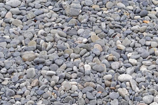 Big pebbles at beach background