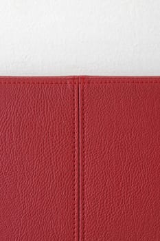 Red leather material with stitching