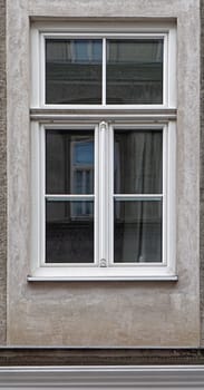 Closed white window at house exterior