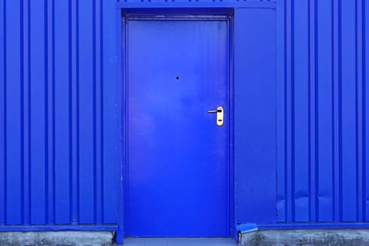 Blue door at industrial building exterior