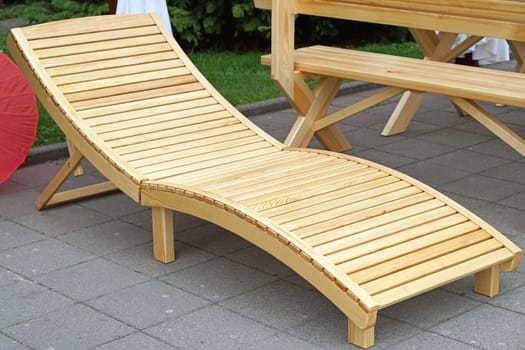 Wooden lounge chair at outdoor patio