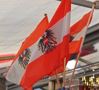 Three Austrian flags with eagles