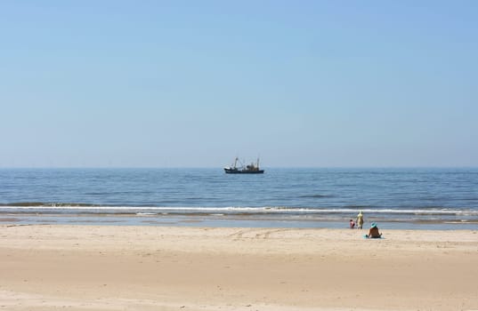 a long lonely sand beach, on the North Sea