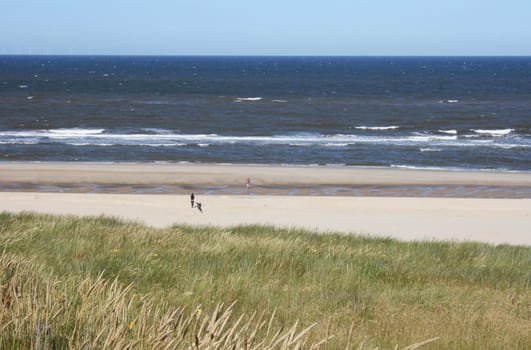 a long lonely sand beach, on the North Sea