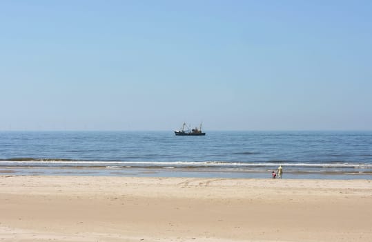 a long lonely sand beach, on the North Sea