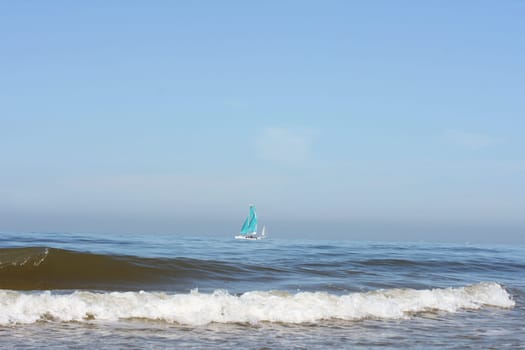 Waves of white foam Crown roll over the sea surface