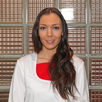 Four female dentist doctors in white uniforms
