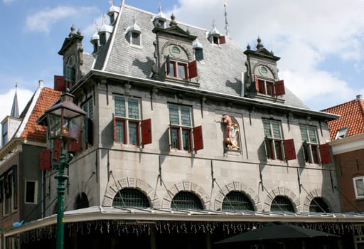 CopyrThe Historic cheese weighing on Roode Steen, Hoorn in Netherlands.