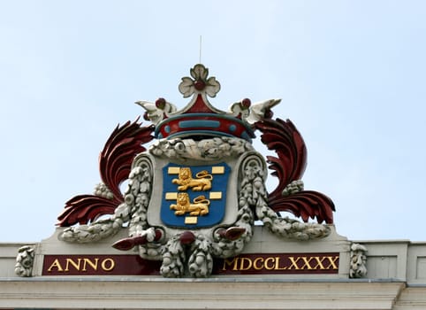 Coat of arms of Golden Lion, blue sky in the background