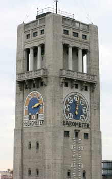 A large tower with hygrometer and barometer pointer