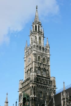 Church with  cross and clock, in the Bavarian State capital of Munich.