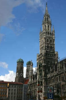 Church with  cross and clock, in the Bavarian State capital of Munich.