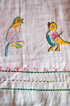 ornamental hand made embroidered smooth decoration on white fabric , vintage folk embroidery in Belarus, second half of 19 century