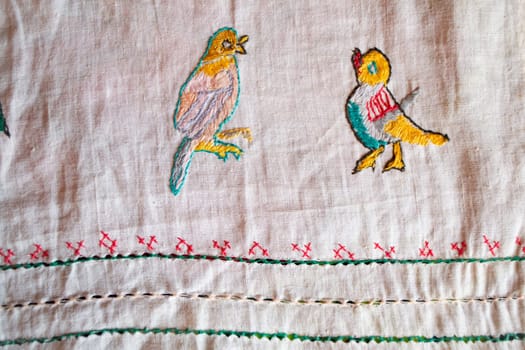 country hand made embroidered smooth decoration on white fabric , vintage folk embroidery in Belarus, second half of 19 century