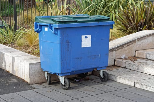 Blue plastic container for garbage and trash