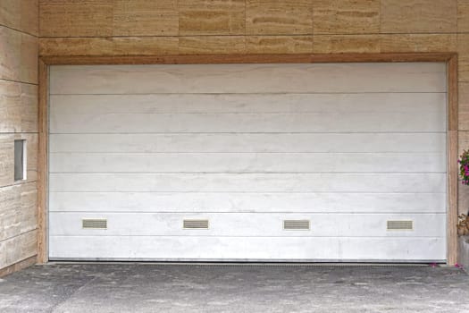 Wide white garage door closed
