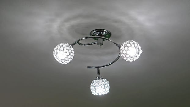 Modern chandelier with three led light bulbs
