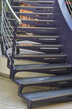 Purple metal staircase with banister