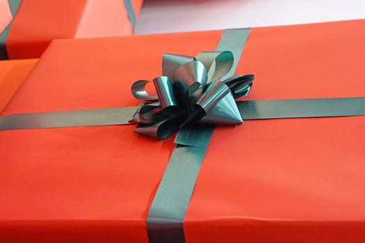 Red gift wrap with green ribbon