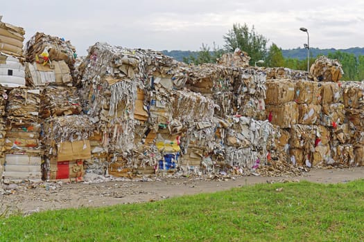 Paper and carboard carton material stacked for recycling