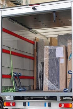 Packed furniture shipment in delivery truck