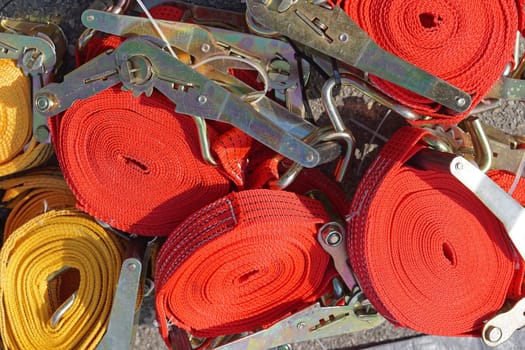 Ratchet straps for securing cargo at trucks