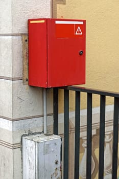 Red box with electric cut off safety switch at house wall