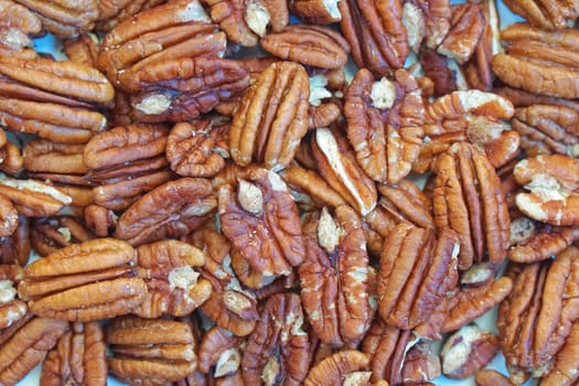 Big bunch of shelled pecans nuts