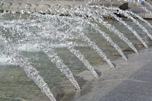 Decorative water fountain spray geysers with pond