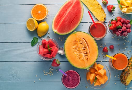 Healthy smoothies with fresh fruit ingredients. Colorful and creative summer table