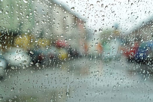 Rainy day abstract weather photo trough wet window