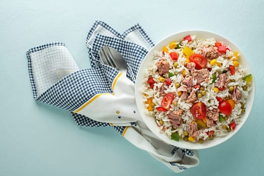 Fresh rice salad with tuna and vegetables in a bowl close up shoot