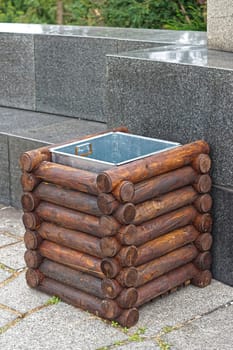 Wooden litter waste bin in park