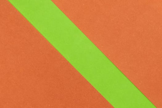 Green and Orange coloured paper background, abstract contrast conceptual image