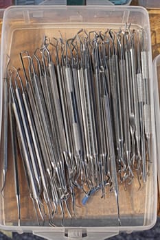 Collection of various medical dental instruments equipment in box