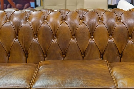 Brown leather sofa backrest upholstery pattern
