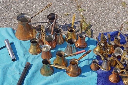 Many old brass and copper coffee pots