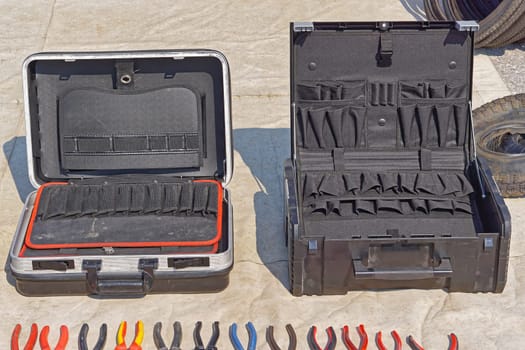 Two empty tool boxes suitcases with organizers