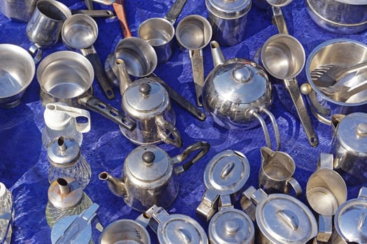Many stainless steel metal cooking pots
