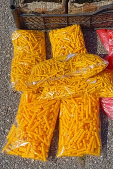 Yellow plastic wall plugs in bags material
