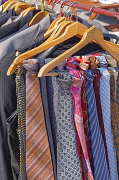 Colourful silk neck ties assortment at coat hangers