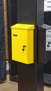 Bright yellow mail box with keys