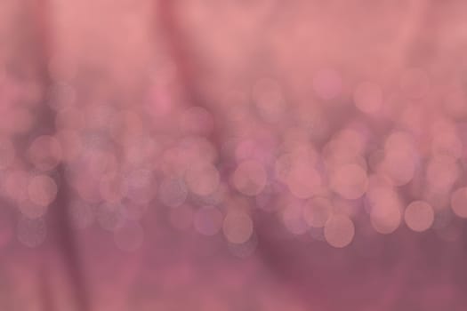 A festive abstract purple pink gradient background texture with glittering stars and bokeh circles. Card concept for Happy New Year, party invitation, valentine or other holidays.