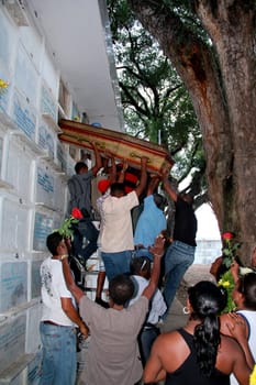 salvador, bahia / brazil - november 7, 2012: people are seen during seputation of a person in the Quinta dos Lazaros cemetery in the city of Salvador.