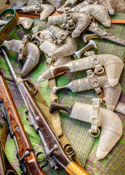 Khanjars and rifles on display at the gun Friday market in Nizwa, Oman
