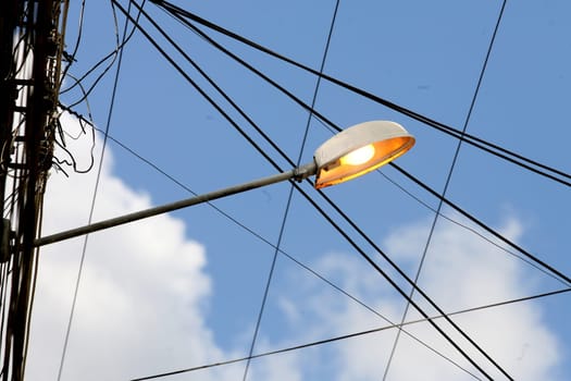 itabuna, bahia / brazil - april 13, 2012: street lamp post is seen lit during the day in the city of Itabuna.