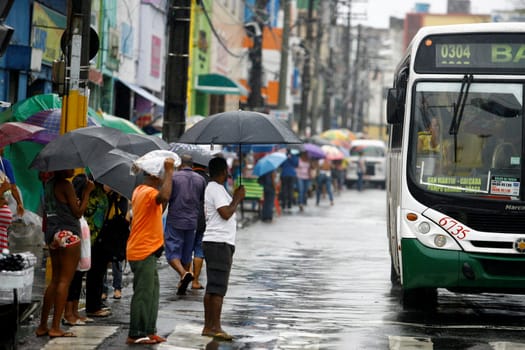 salvador, bahia / brazil - august 26, 2016: People are seen using umbrella during rain in the city of Salvador.