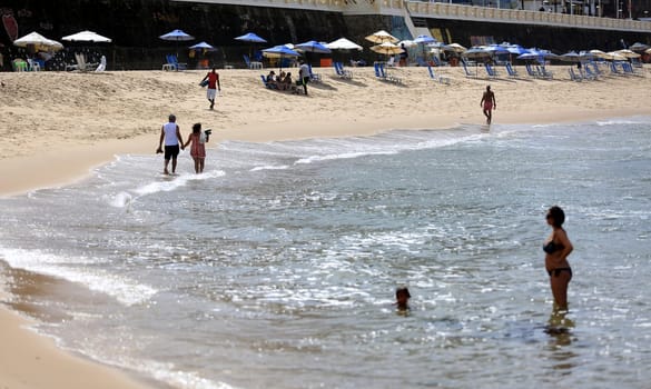salvador, bahia / brazil - august 28, 2018: people are seen at Barra beach in the city of Salvador.