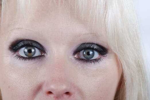 Close up the eyes of a young blond woman