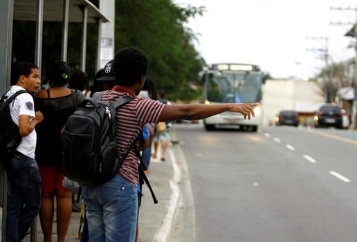 salvador, bahia / brazil - august 7, 2014: people are seen at public transport bus stop in the city of Salvador.